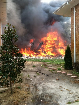 Illustration for article titled F-18 Crashes into Apartment Building and Explodes (Update: No Deaths)